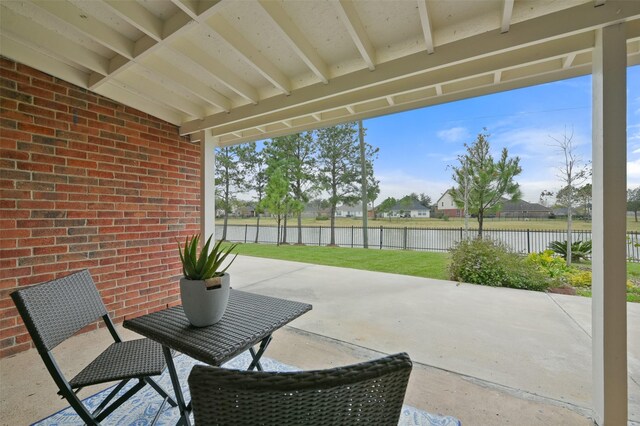 view of patio featuring a water view