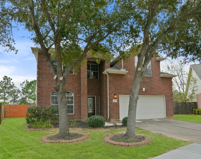 view of front of property with a front lawn and a garage