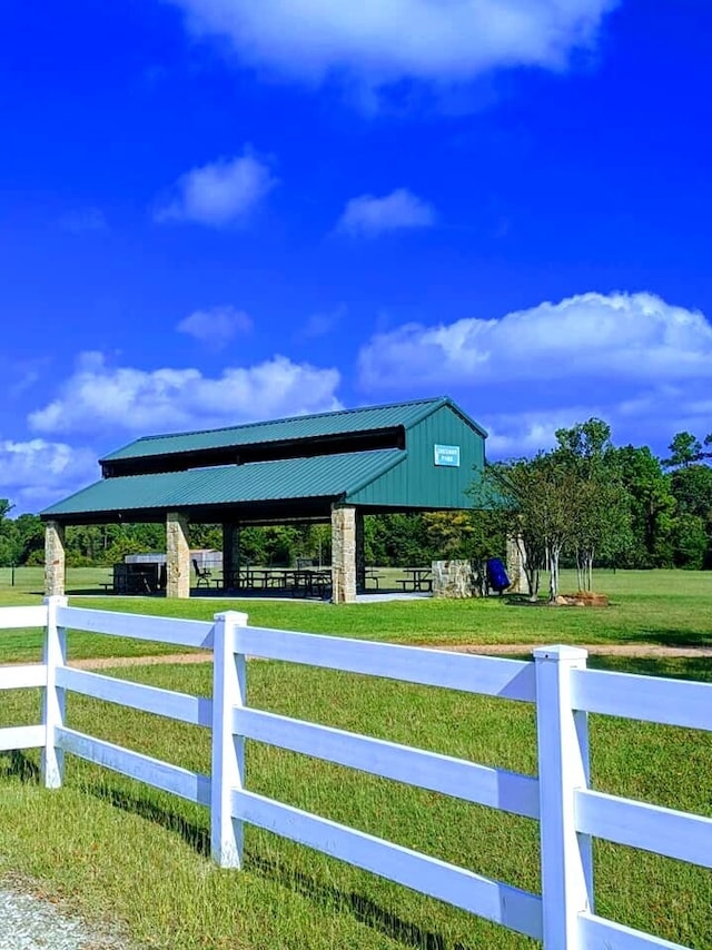 view of car parking featuring a lawn