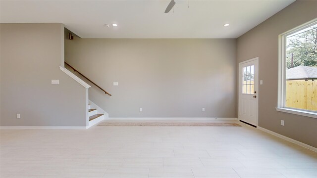 unfurnished room featuring ceiling fan