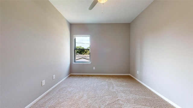 unfurnished room with light carpet, ceiling fan, and baseboards