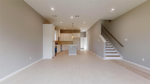 unfurnished living room with stairway, visible vents, baseboards, and recessed lighting