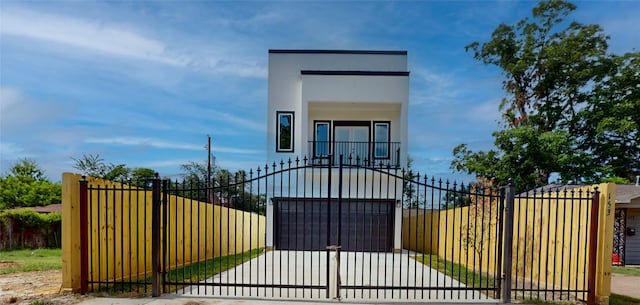 view of gate featuring a garage