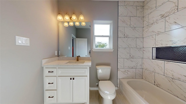 full bathroom featuring vanity, toilet, and tiled shower / bath combo