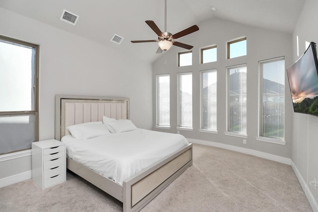 carpeted bedroom with vaulted ceiling and ceiling fan