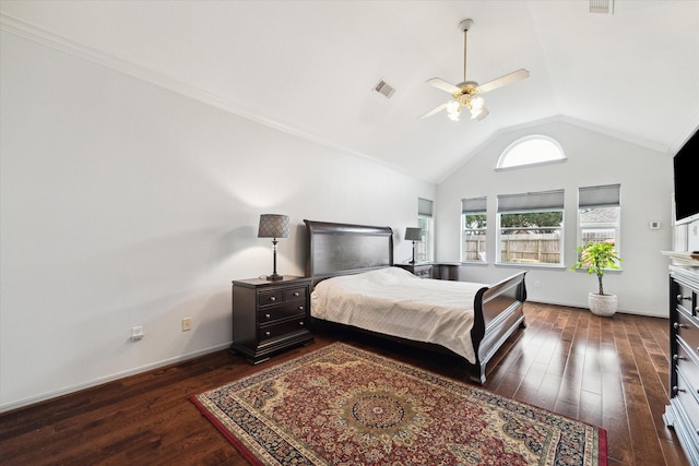 bedroom with ceiling fan, dark hardwood / wood-style floors, and vaulted ceiling