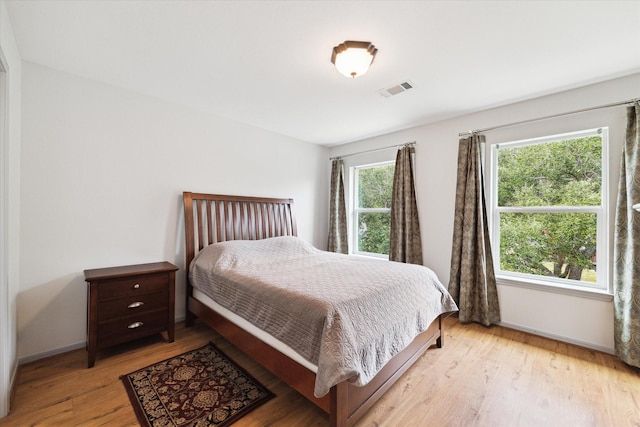 bedroom with light hardwood / wood-style flooring