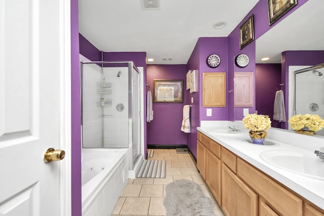 bathroom featuring vanity, tile patterned flooring, and plus walk in shower