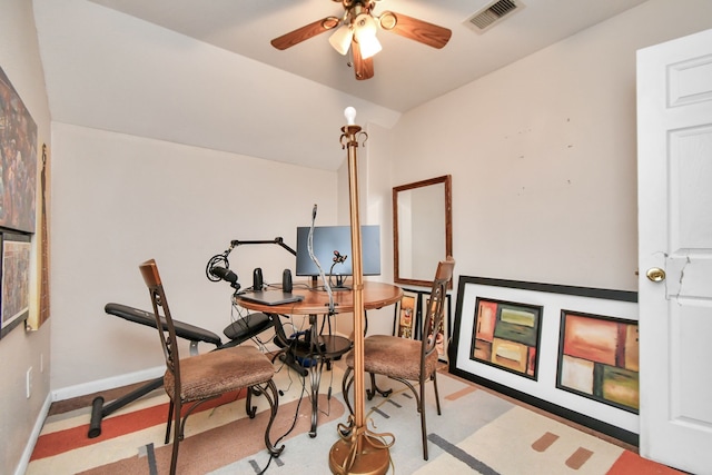 interior space with light colored carpet, ceiling fan, and lofted ceiling