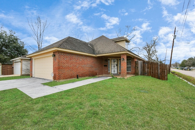 view of front of home with a garage and a front yard