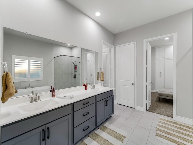 bathroom featuring tile patterned floors, vanity, and separate shower and tub