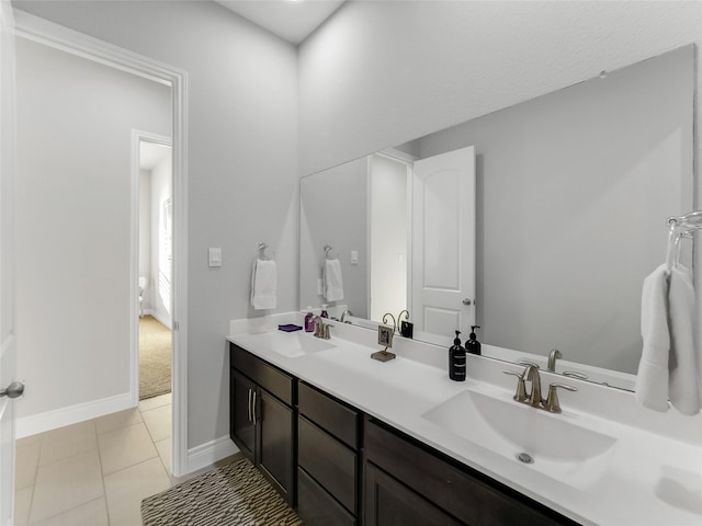 bathroom with tile patterned floors and vanity