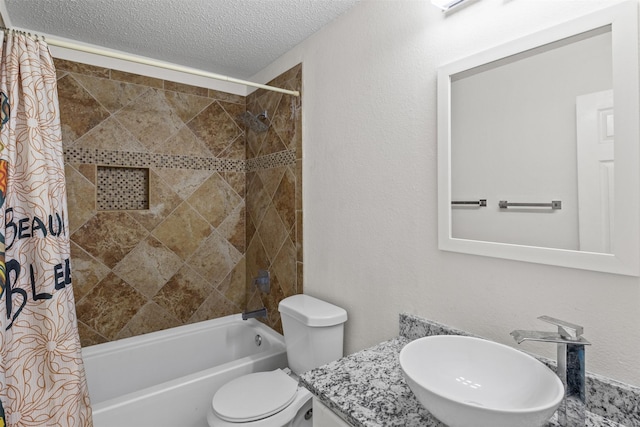 full bathroom with vanity, toilet, shower / bathtub combination with curtain, and a textured ceiling