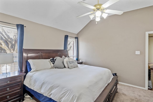 carpeted bedroom featuring ceiling fan and vaulted ceiling