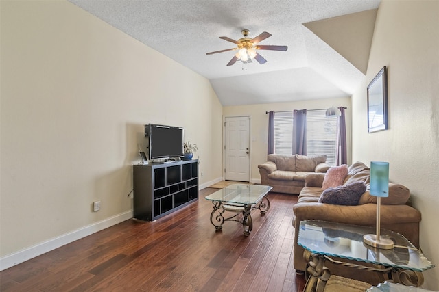 living room featuring a textured ceiling, dark hardwood / wood-style flooring, ceiling fan, and lofted ceiling