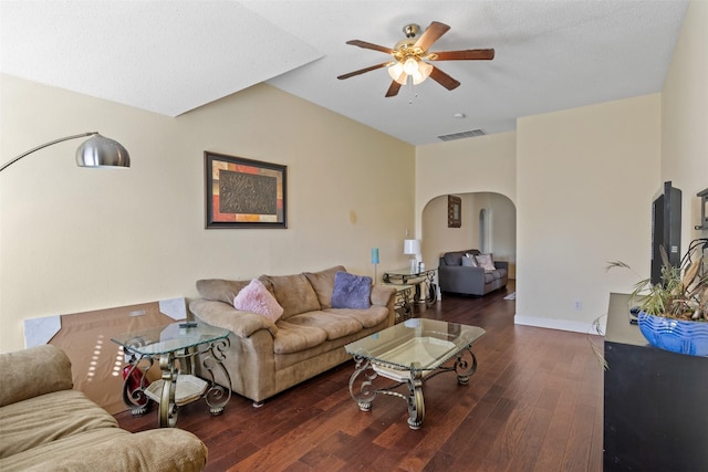 living room with ceiling fan and dark hardwood / wood-style floors