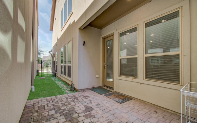 doorway to property with a patio area