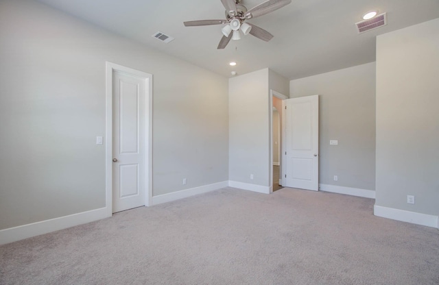 empty room with light carpet and ceiling fan