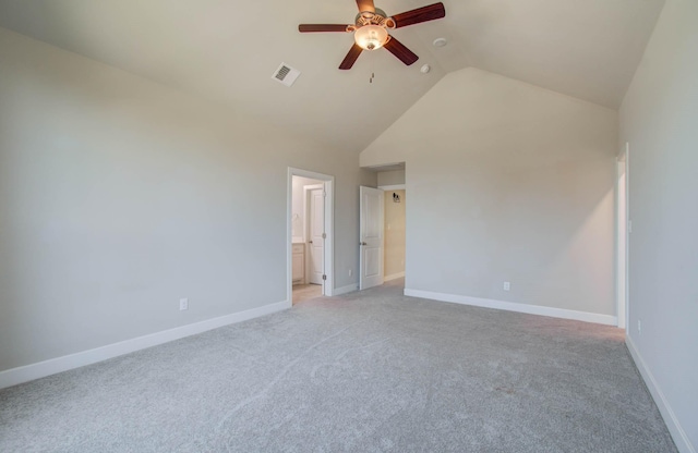 carpeted spare room with high vaulted ceiling and ceiling fan