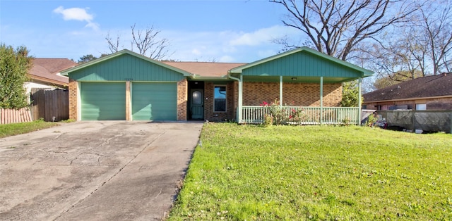 ranch-style house featuring covered porch, a garage, and a front lawn