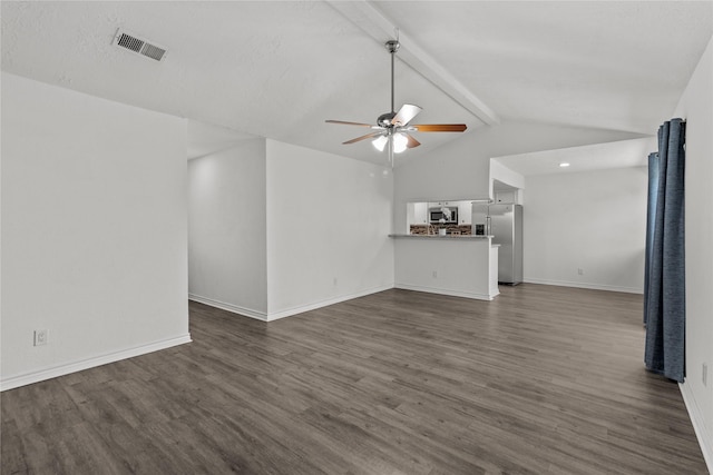 unfurnished living room with ceiling fan, dark hardwood / wood-style flooring, and vaulted ceiling with beams