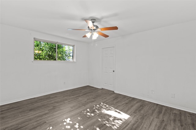 unfurnished room featuring ceiling fan and dark hardwood / wood-style flooring