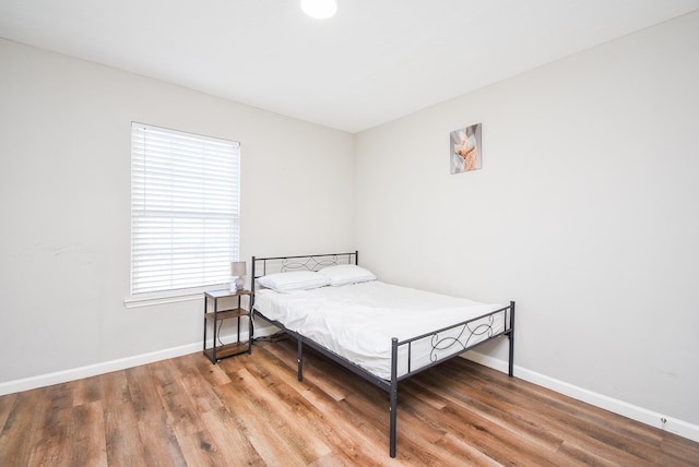 bedroom featuring hardwood / wood-style flooring