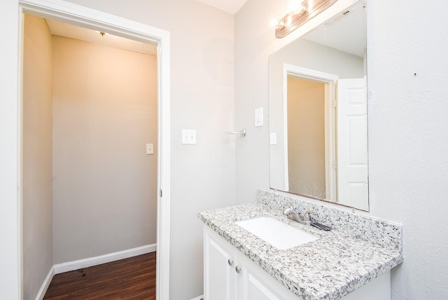 bathroom with vanity and hardwood / wood-style floors