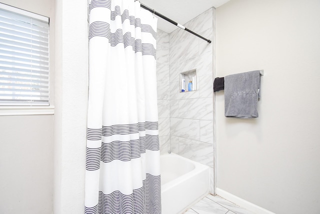 bathroom featuring shower / bath combination with curtain