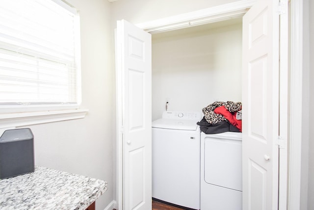 clothes washing area with washer and dryer