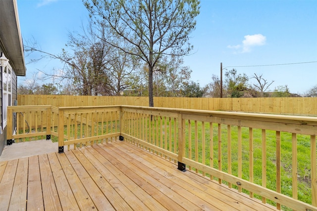 wooden terrace with a yard