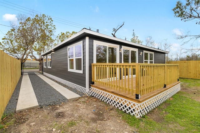 view of home's exterior featuring a deck