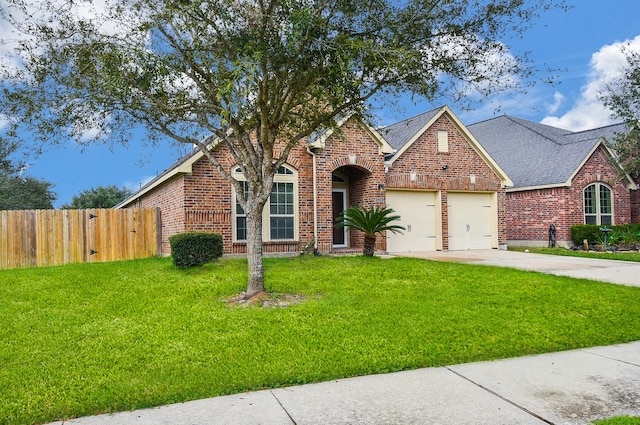 view of front facade with a front lawn and a garage