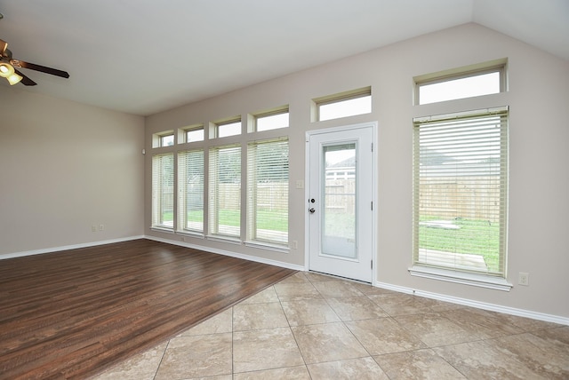 interior space with ceiling fan and light tile patterned floors