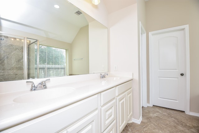 bathroom featuring vanity, vaulted ceiling, and walk in shower