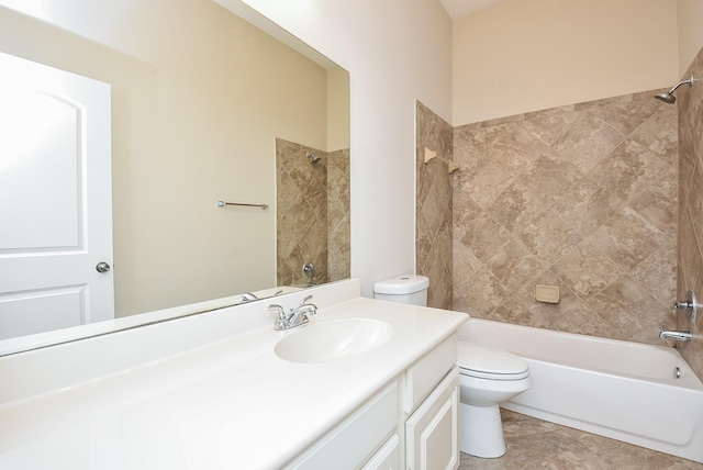 full bathroom with vanity, toilet, and tiled shower / bath combo