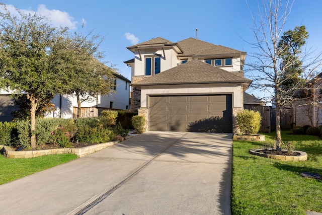 view of front of home featuring a garage and a front lawn