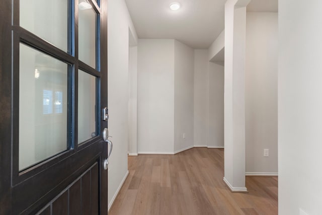 foyer entrance with light wood-type flooring