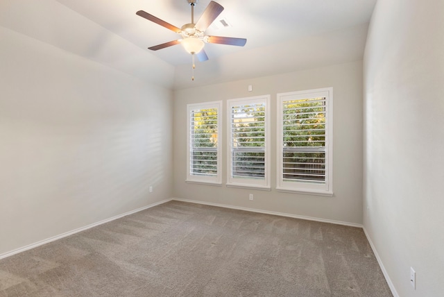 unfurnished room with ceiling fan, carpet, and vaulted ceiling