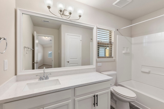 full bathroom featuring vanity, tub / shower combination, and toilet