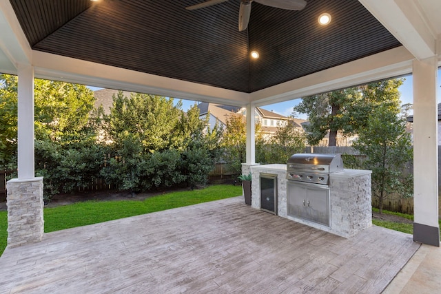 view of patio featuring area for grilling, ceiling fan, and grilling area