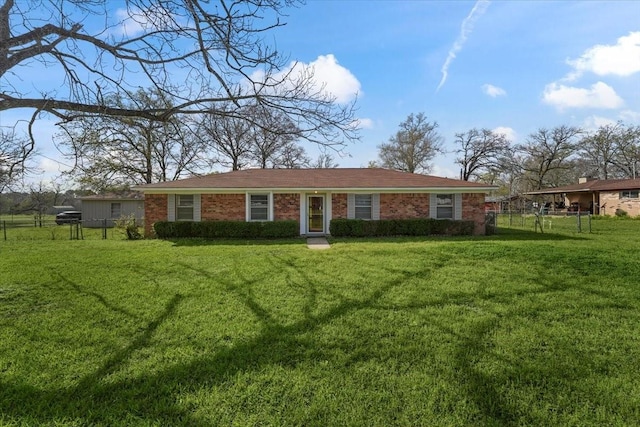 ranch-style house with a front lawn