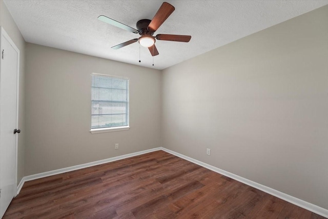 unfurnished room featuring a textured ceiling, dark hardwood / wood-style floors, and ceiling fan