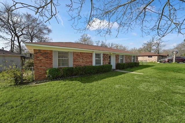 ranch-style house with a front lawn