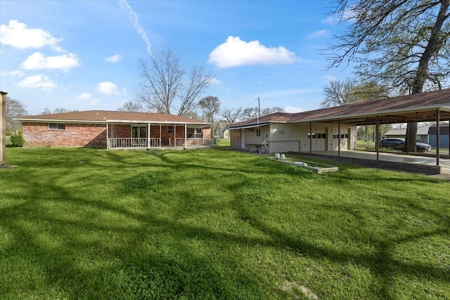 back of house with a lawn