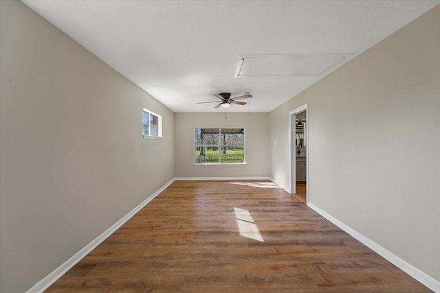 empty room featuring ceiling fan and wood-type flooring