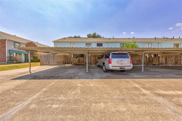 view of parking / parking lot with a carport