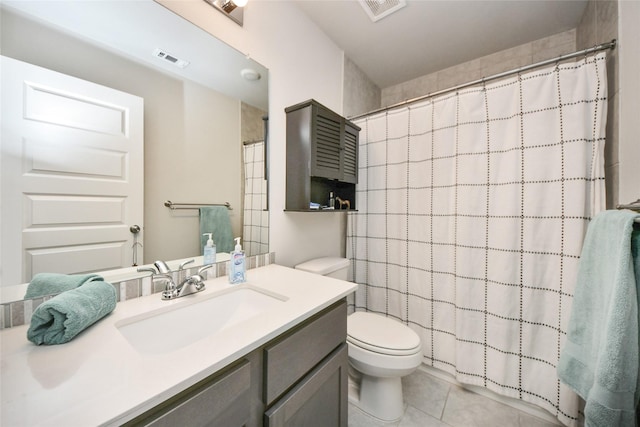 bathroom with a shower with shower curtain, vanity, toilet, and tile patterned flooring