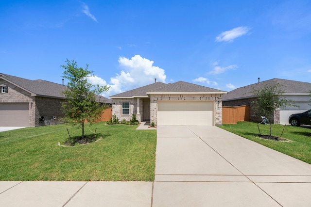 view of front of home featuring a front yard and a garage