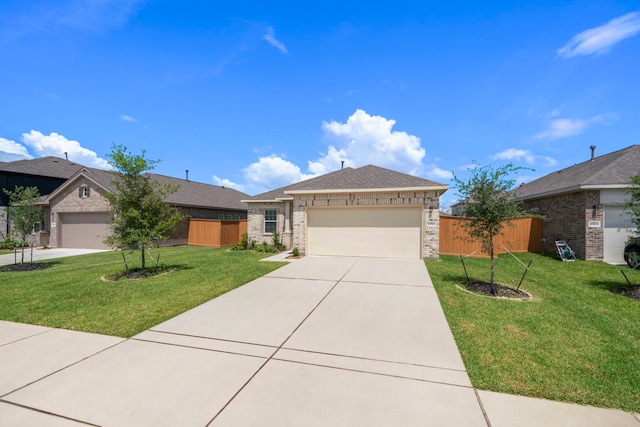 view of front of property featuring a garage and a front lawn